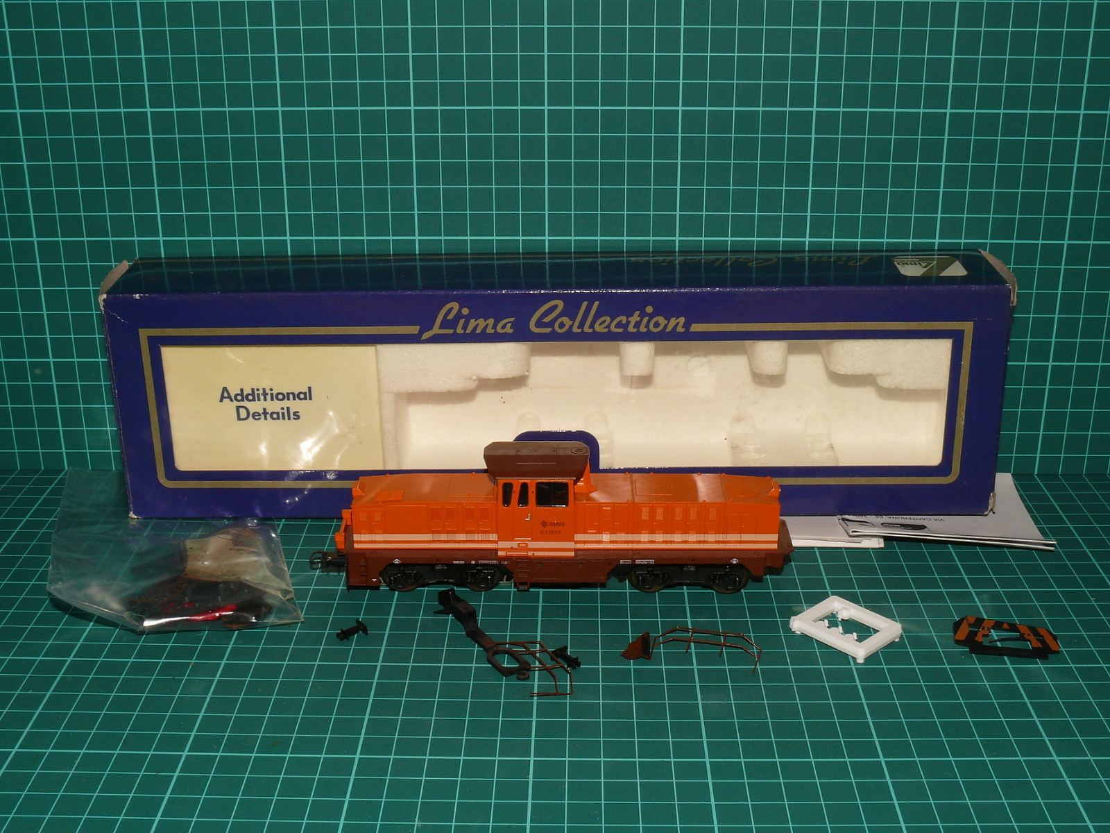 Lima Collection H0 - Dieselová lokomotiva řady 311 (311-001-2) RENFE pro systém Märklin (AC střídavý), oranžová s krabičkou (1:87) – H0