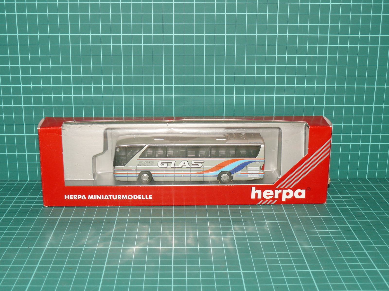 HERPA H0 – Dálkový zájezdový autobus Mercedes-Benz O 404 „GLAS“ (1:87, reklamní edice, OVP) – H0