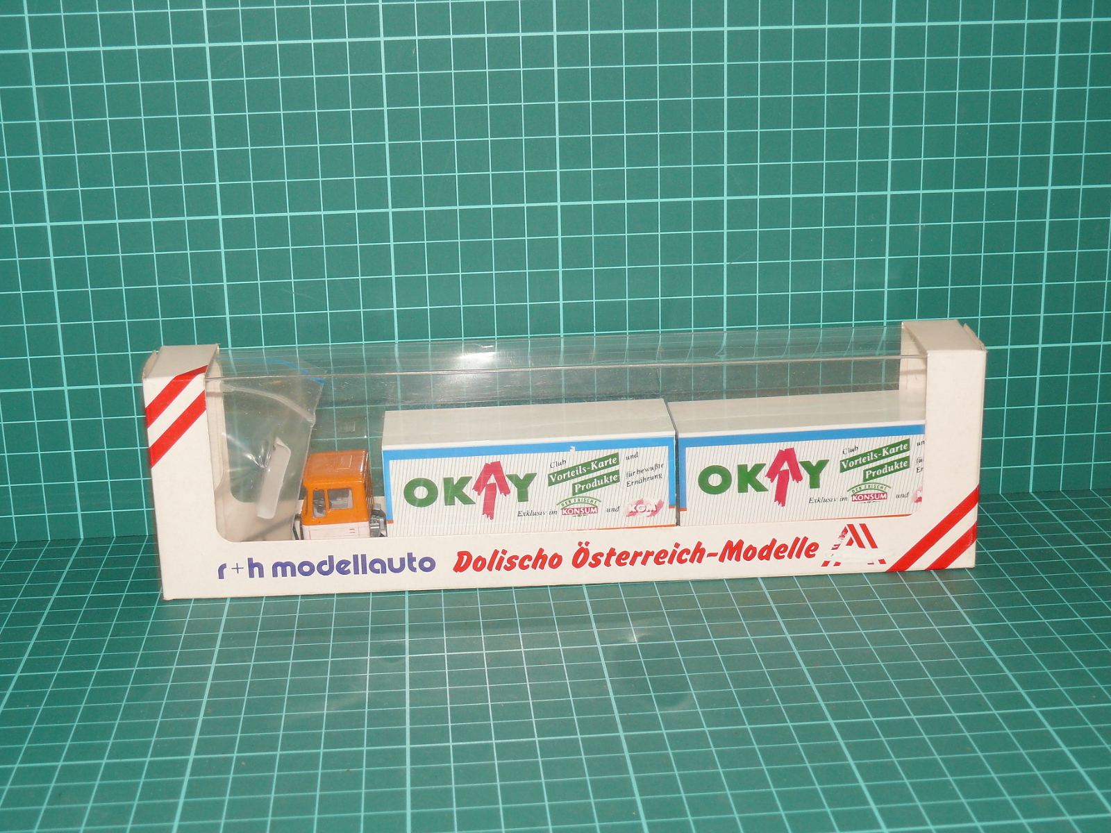 R+H MODELLAUTO / DOLISCHO H0 – Kamionová souprava s přívěsem MAN F90 „OKAY – KONSUM / KÖG“ (1:87, OVP) – H0