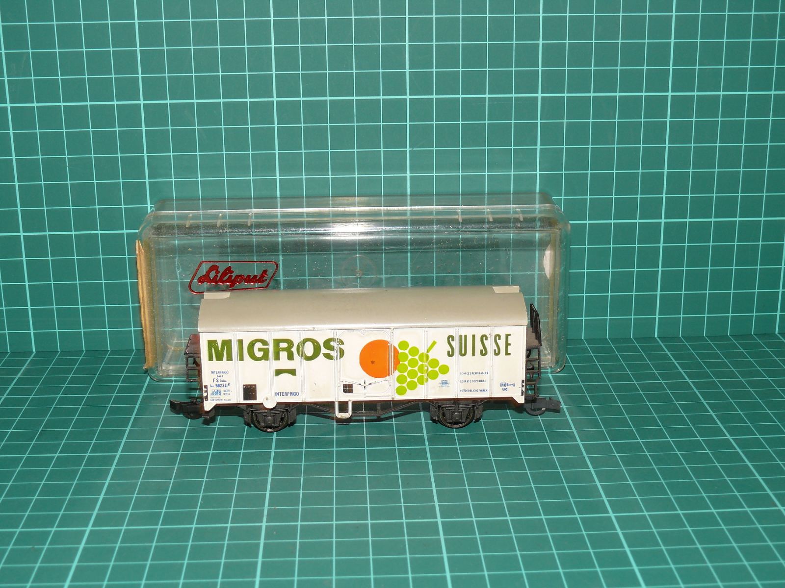 Liliput H0 – Chladicí dvounápravový vůz s plošinou „MIGROS SUISSE“ FS / INTERFRIGO (kat. č. 235 20, OVP) – H0