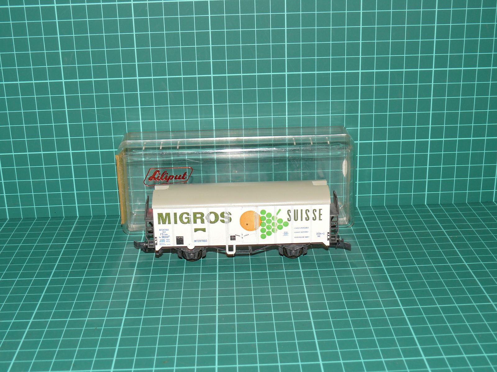 Liliput H0 – Chladicí dvounápravový vůz s plošinou „MIGROS SUISSE“ FS / INTERFRIGO (kat. č. 224 30, OVP) – H0