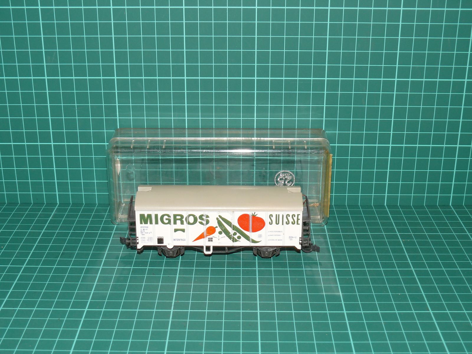 Liliput H0 – Chladicí dvounápravový vůz s plošinou „MIGROS SUISSE“ FS / INTERFRIGO (kat. č. 224 30, OVP) – H0